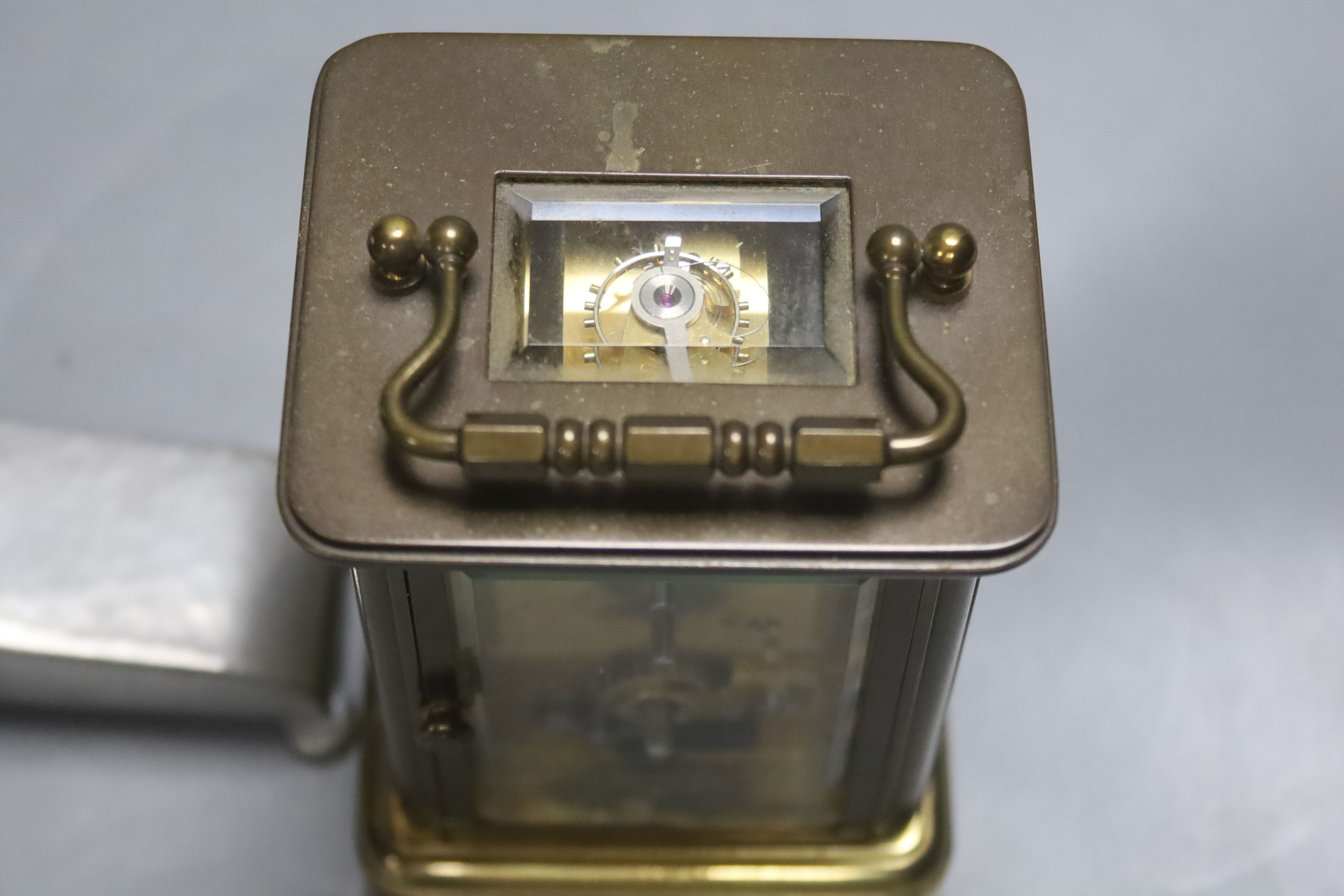 A French Obis cased brass carriage timepiece and a Liberty's Tudric pewter mantel timepiece, dial signed Newport, 21cm wide